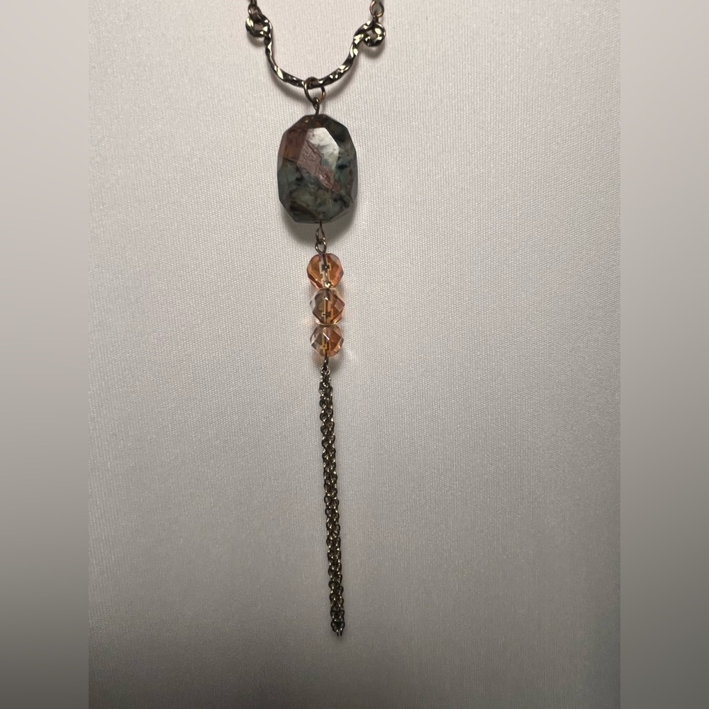 Gift with purchase -Long beaded necklace maybe turquoise. Gold tone tassel